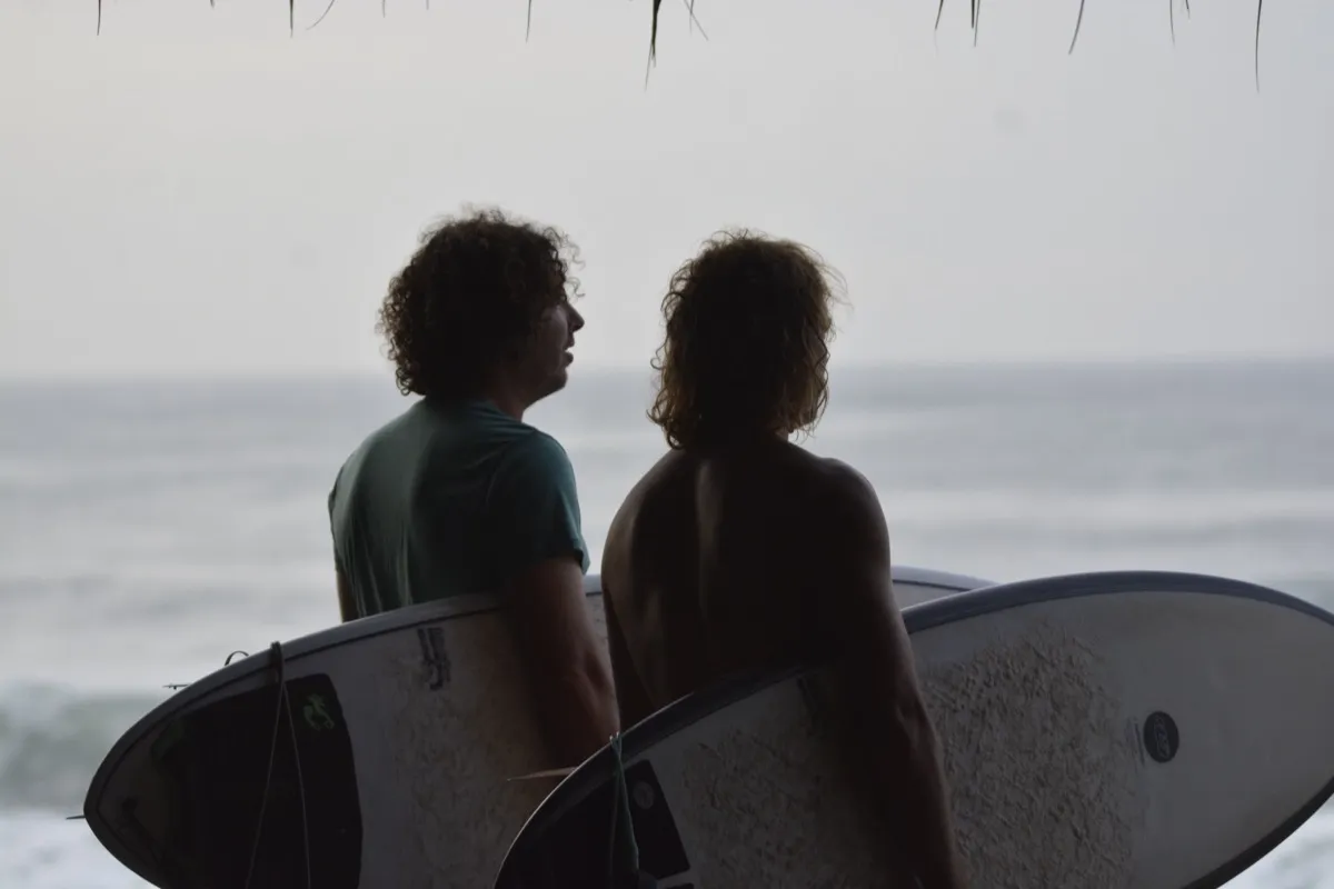 Surfers watching the waves in Central America